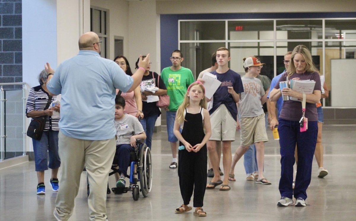 Assistant principal Patrick Moore leads a group around Memorial High School. Moore and the other admin worked hard to make sure the school was ready for the first week. 