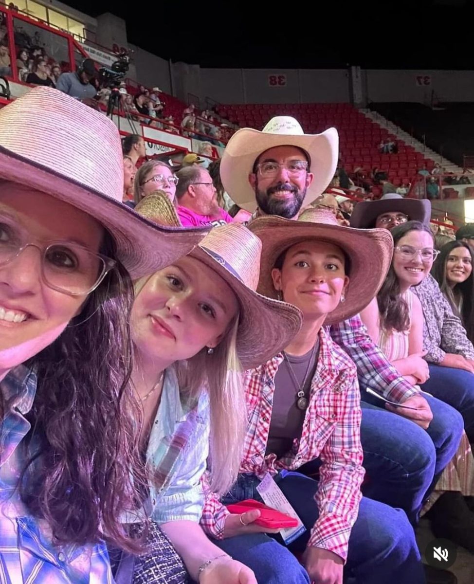 Concepcion Martinez Olivares (third from right) takes a group picture with her host family at the recent rodeo at Kay Yeager Coliseum. 