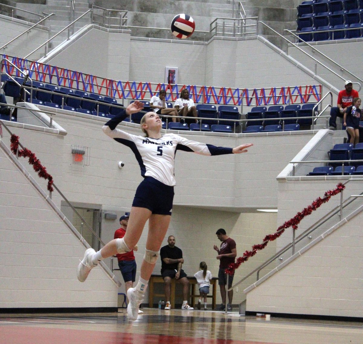 Eva Grisel serves the ball last Friday against Mineral Wells. Grisel is a sophomore who's turned into a leader on the Mavericks. 