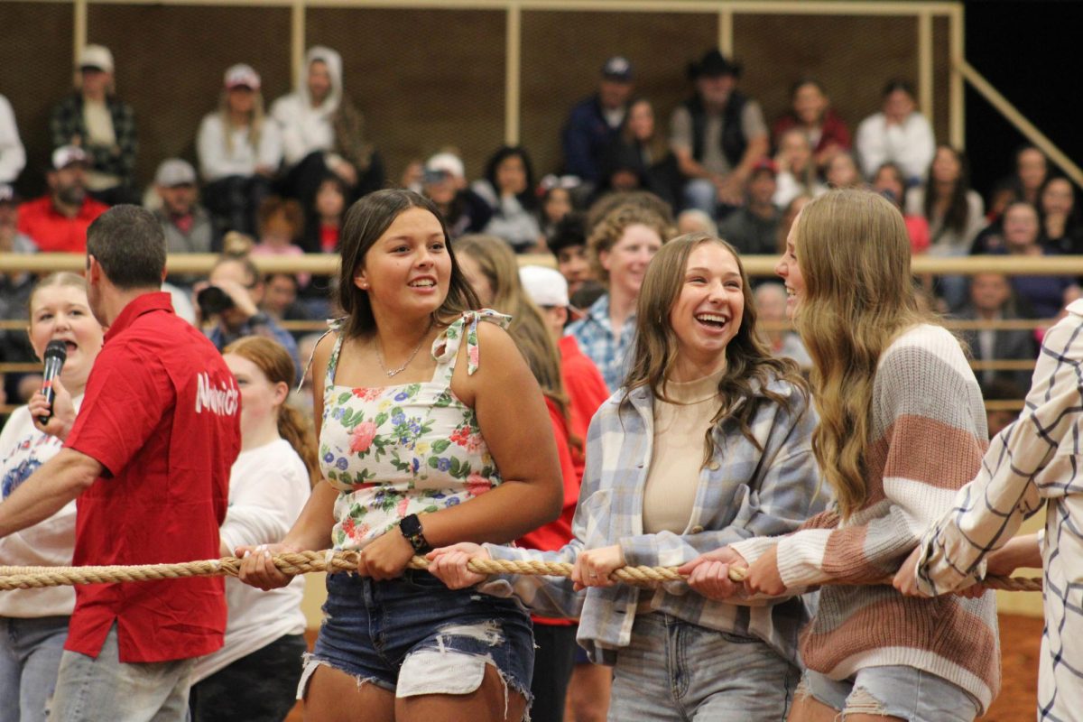 Juniors Bella Coffey, Madi Smith and Brenna Voss prepare to play a game of four-way tug of war. 