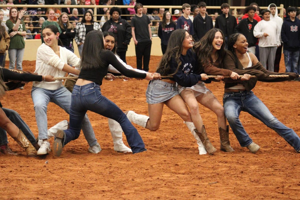 Senior girls play tug of war at Thursday's Stampede that was held at Texoma Cowboy Church. 