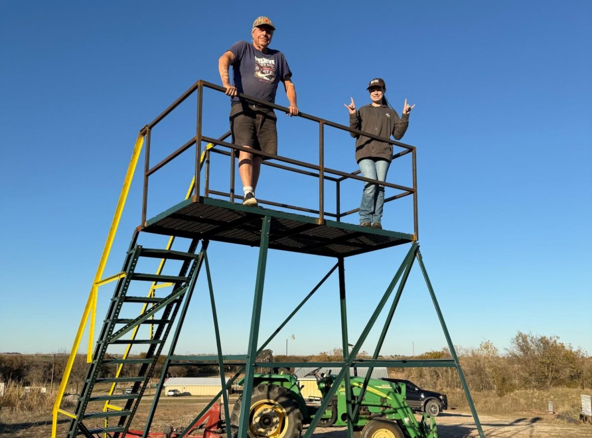 Lorelei Mitchell poses on top of the platform at Northwest Texas Field and Stream that she created for her Eagle Scout project. 