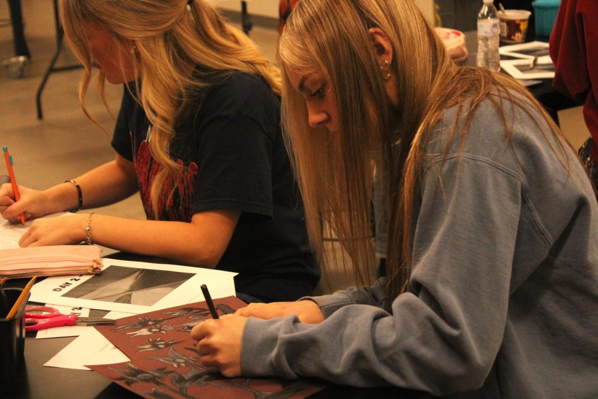 Lily Hansen works on an art project during class. Students have not been able to get on their phones on campus this school year. 